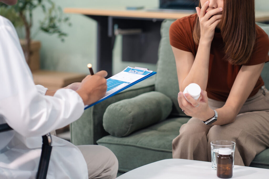 A psychiatrist discussing a personalized medication management plan with a patient for bipolar disorder.