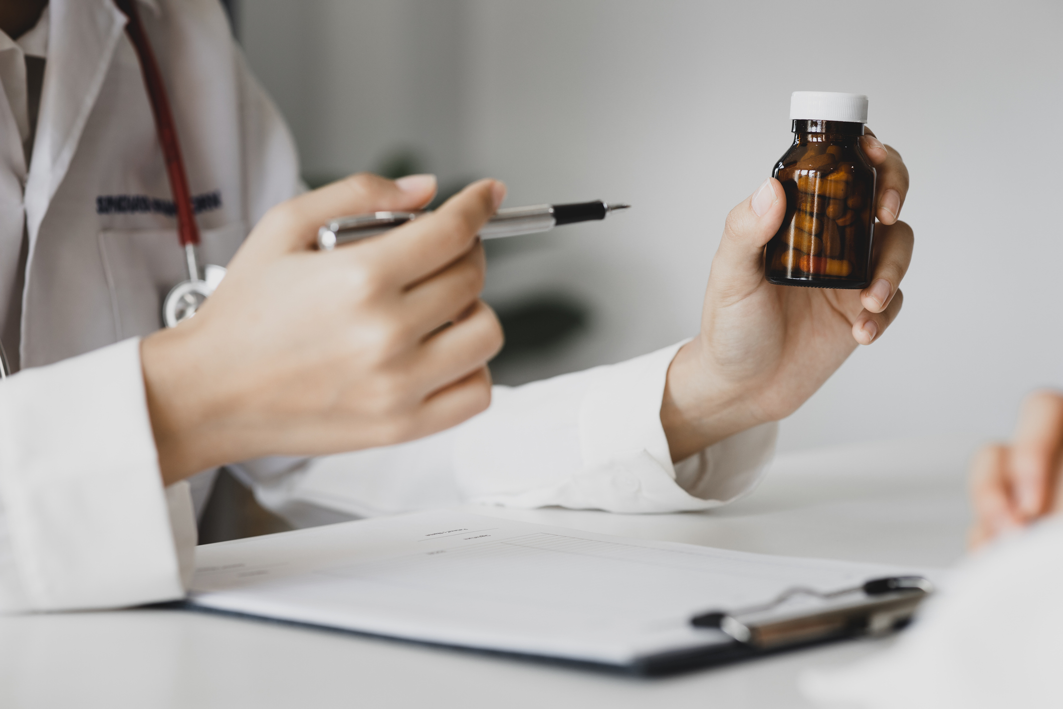 A psychiatrist discussing comprehensive medication management options with a patient in a comfortable clinical setting