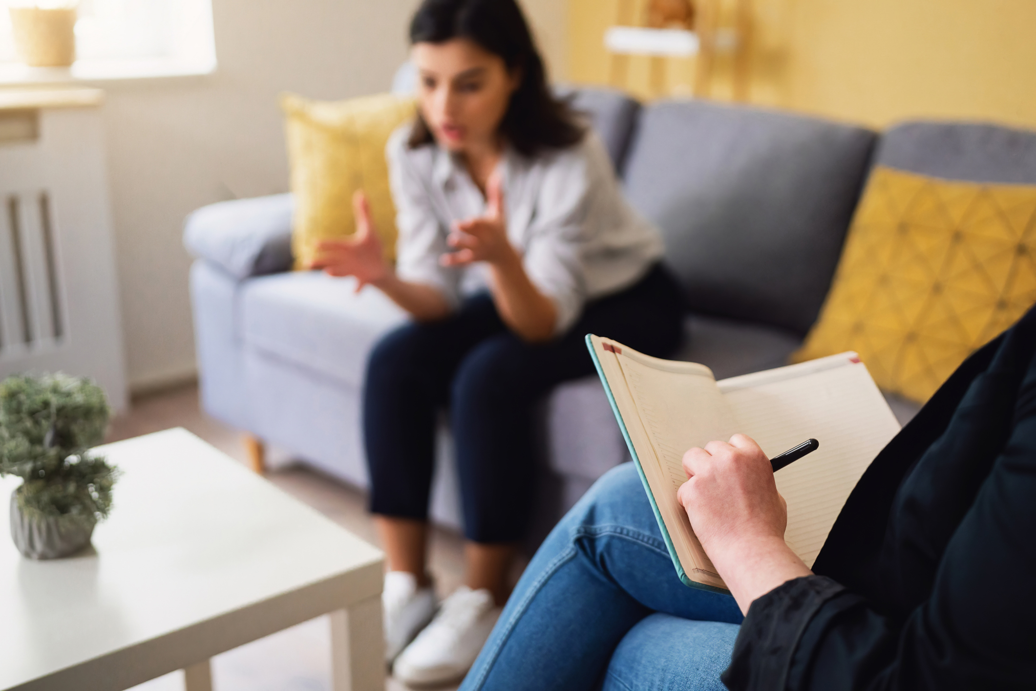 A patient sitting comfortably in a clinical setting, representing options for PTSD treatment such as ketamine therapy and EMDR.
