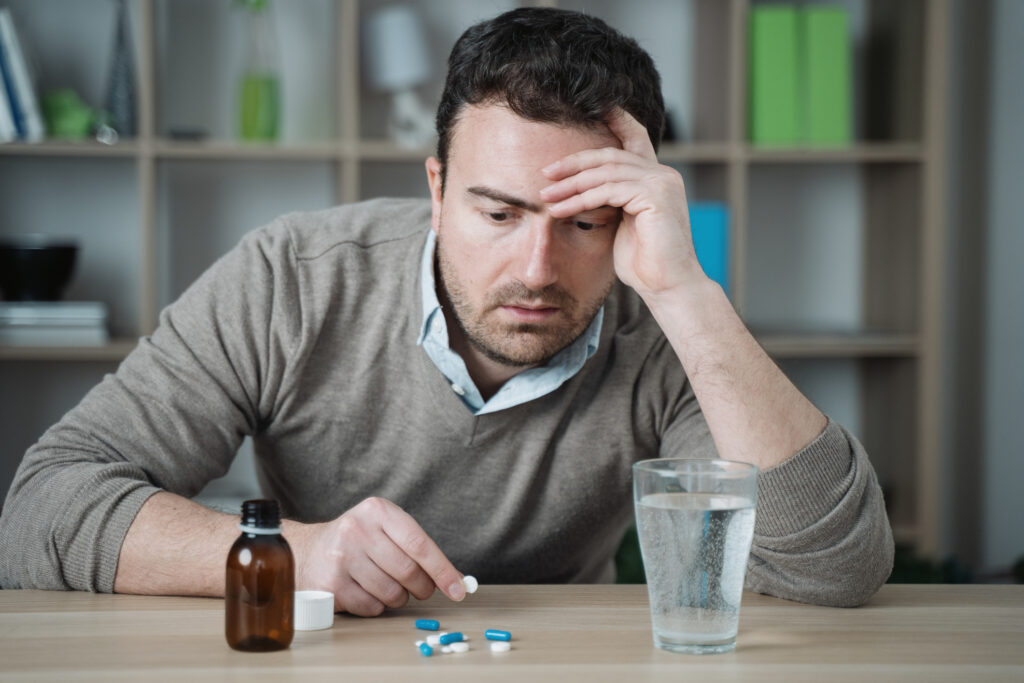 A medical professional discussing TMS therapy and benzodiazepines with a patient seeking relief from persistent anxiety